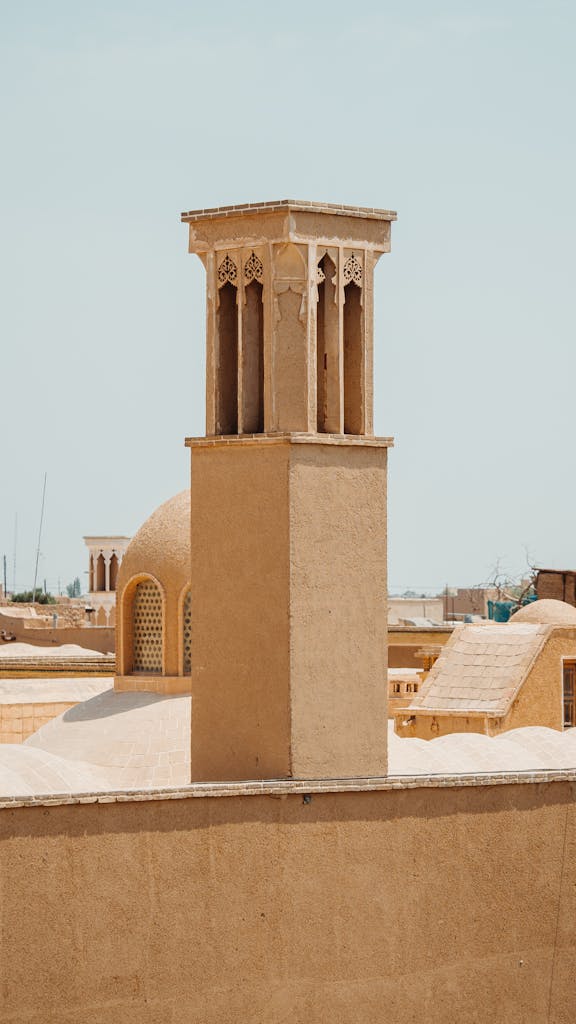 A view of a mosque and a tower in the desert